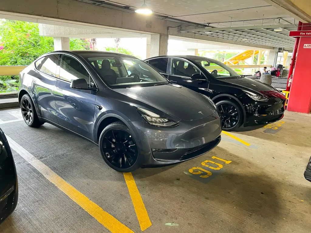 A Couple of Cars Parked in a Parking Garage