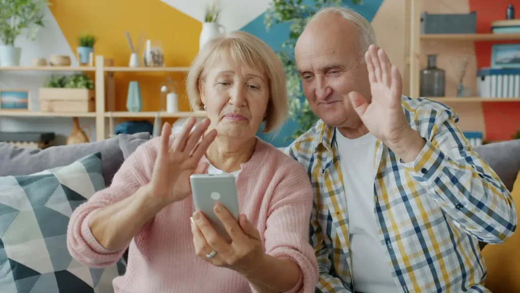 Old Couple Making a Video Call with Their Family 