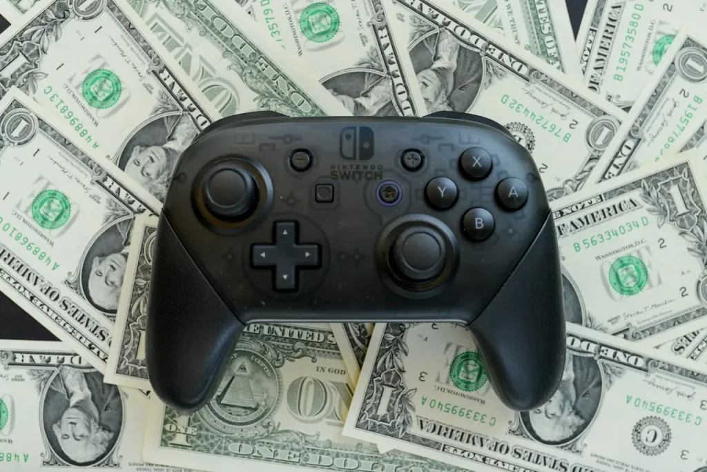 A Gaming Controller on a Pile of Money 