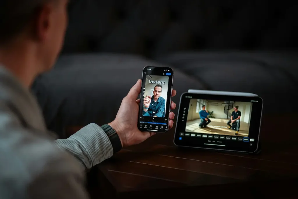 A Man Editing a Video on His Phone While Watching a Podcast