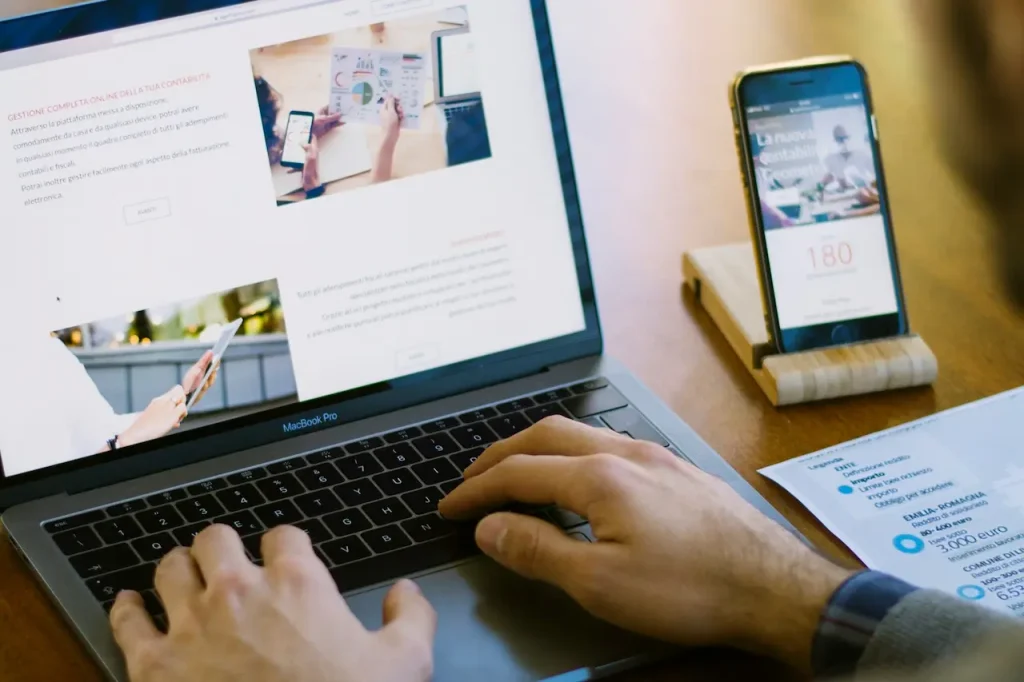 Man Reading an Article on His Laptop 
