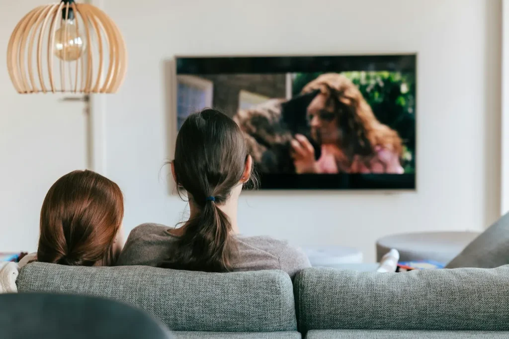 Mother and Daughter Watching TV Together