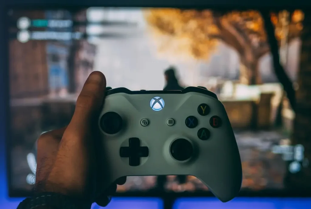 Person Holding White Xbox One Controller 
