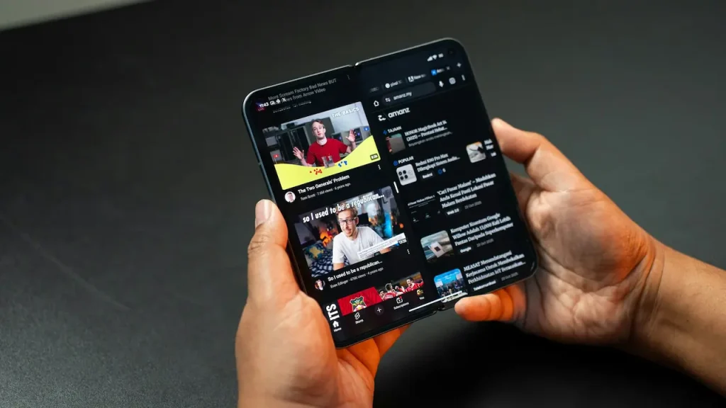 Person Watching YouTube Videos on Their Phone 