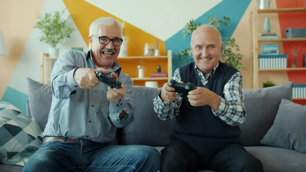 Two Elderly Friends Playing a Video Game 