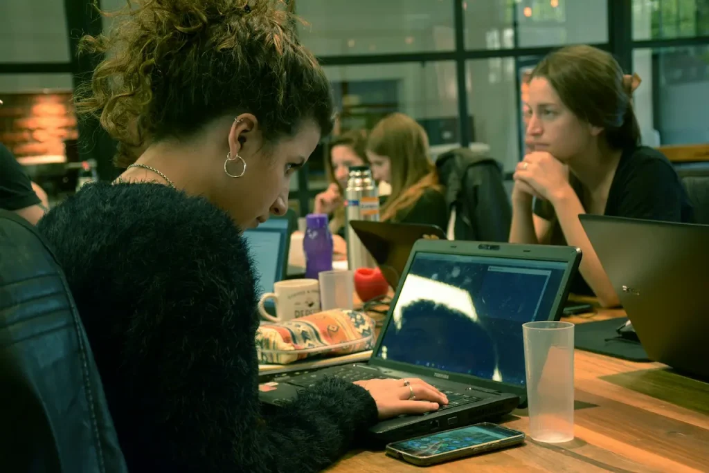 A Group of Students Studying Together on Their Laptops