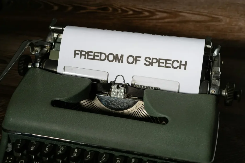 Typewriter Showing Freedom of Speech on Paper