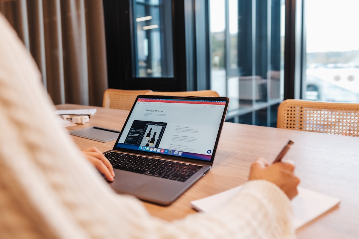 A person building a website on a laptop