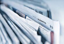 Newspaper and digital technology representing Australia news bargaining debate