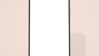 White smartphone with black frame on a pink background