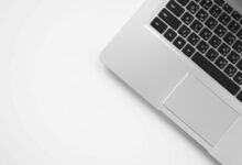 MacBook Pro laptop resting on a white surface