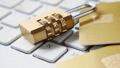 Golden padlock resting on a computer keyboard