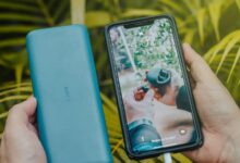 Portable power bank charging a smartphone