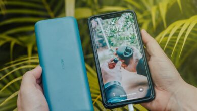 Portable power bank charging a smartphone