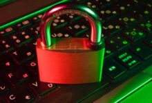 Red padlock resting on a keyboard, symbolising password security