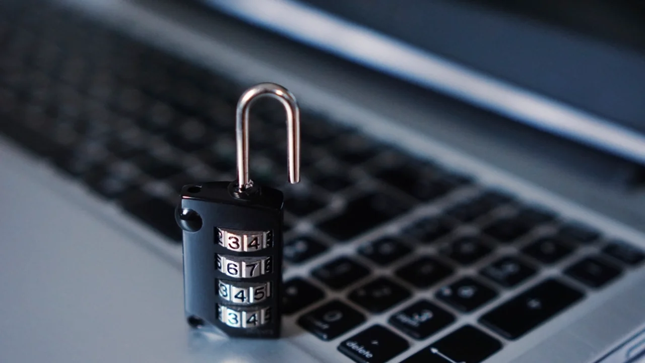 A USB security key next to a smartphone showing an authenticator app, illustrating two-factor authentication options
