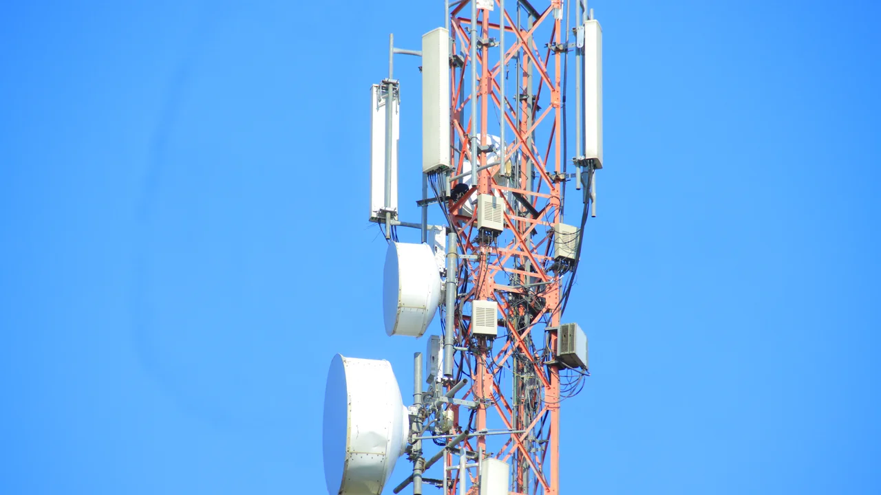 A smartphone showing network signal icons representing Wi-Fi calling and VoLTE settings